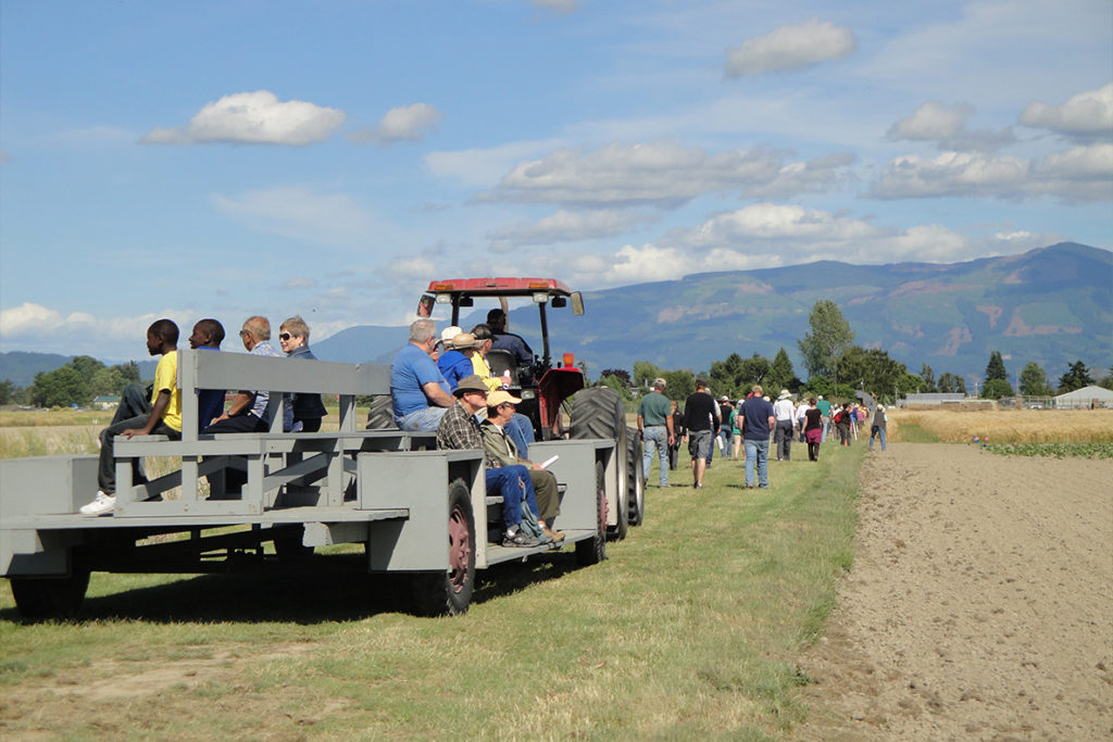 A group of people take a tractor ride in Mount Vernon.