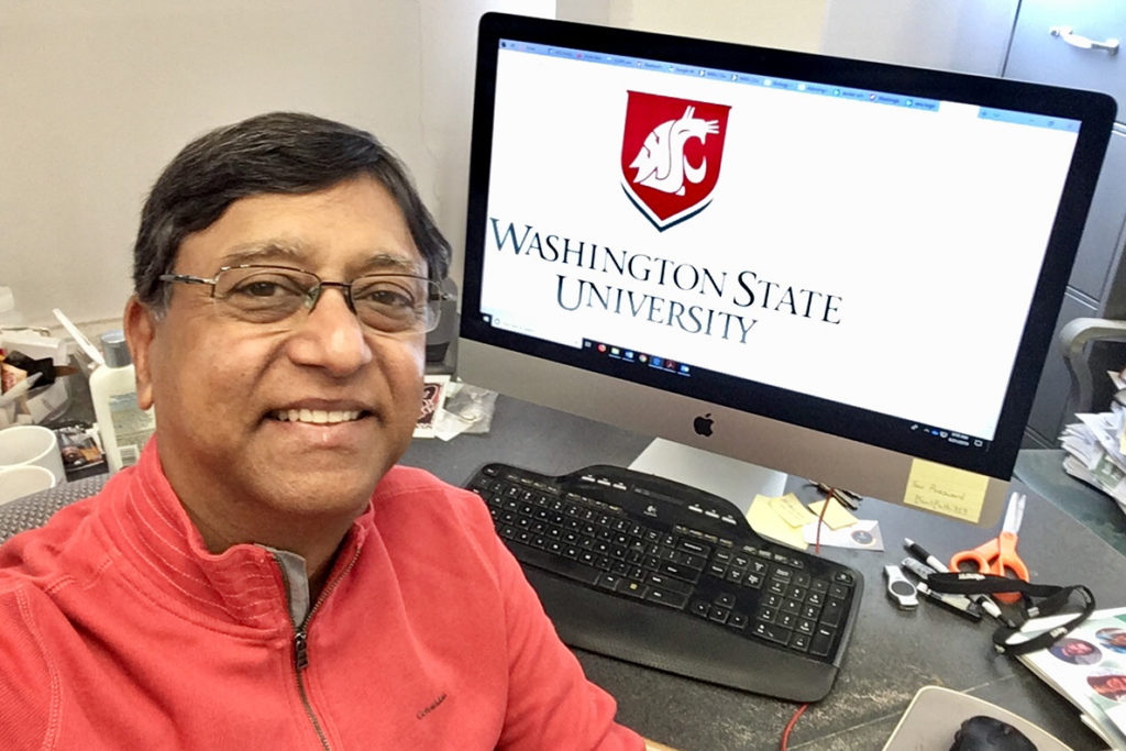 A closeup of Hanu Pappu at his computer.