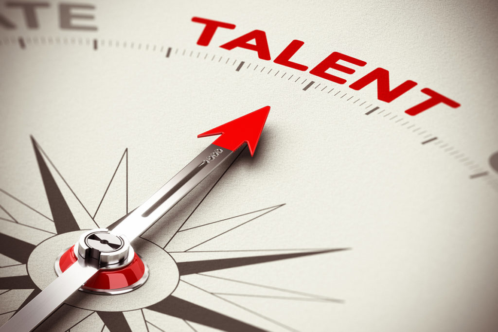 Compass with an arrow pointing towards 'Talent'.