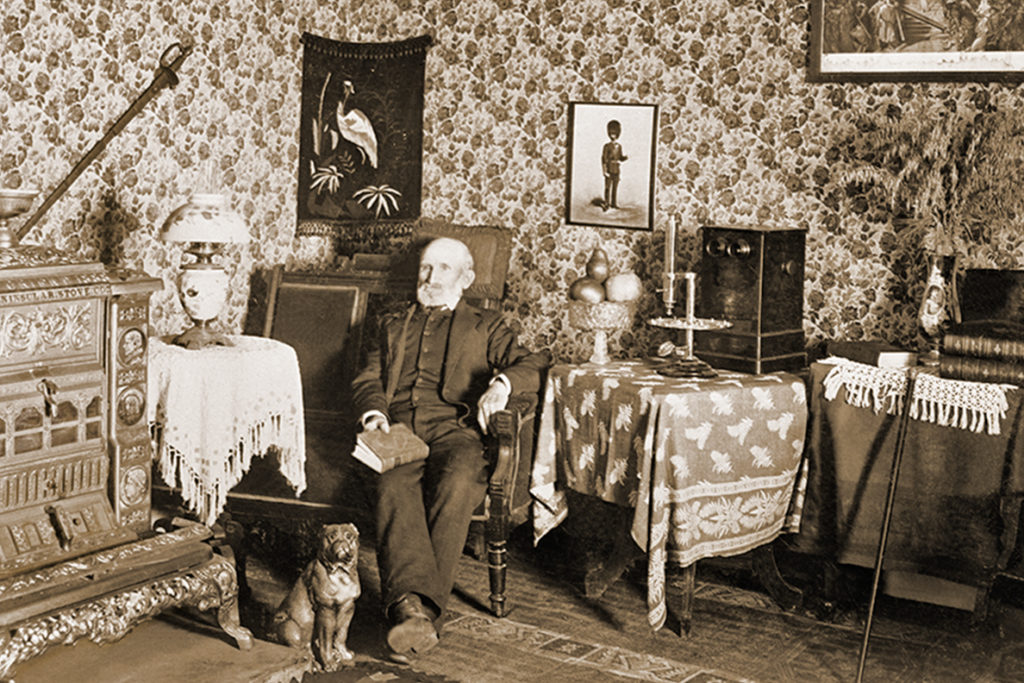 Cashup Davis sits inside the lobby of the hotel he built on top of Steppe Toe Butte.
