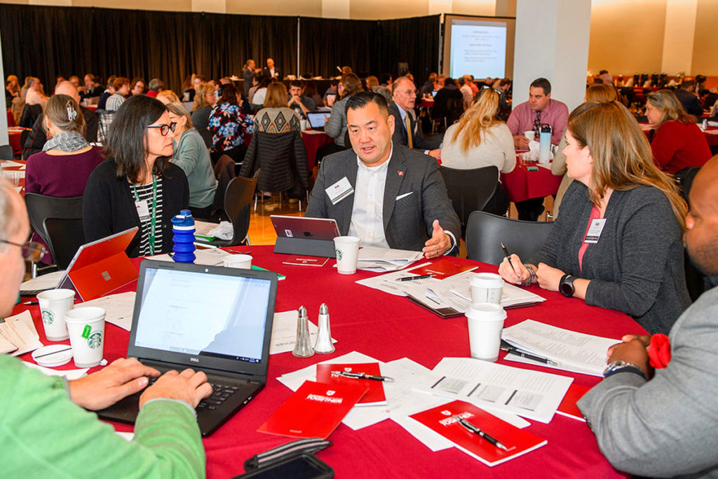 Visioning conference attendees participating in group discussions.