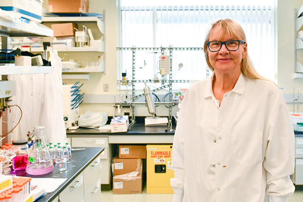 Birgitte Ahring standing in laboratory.