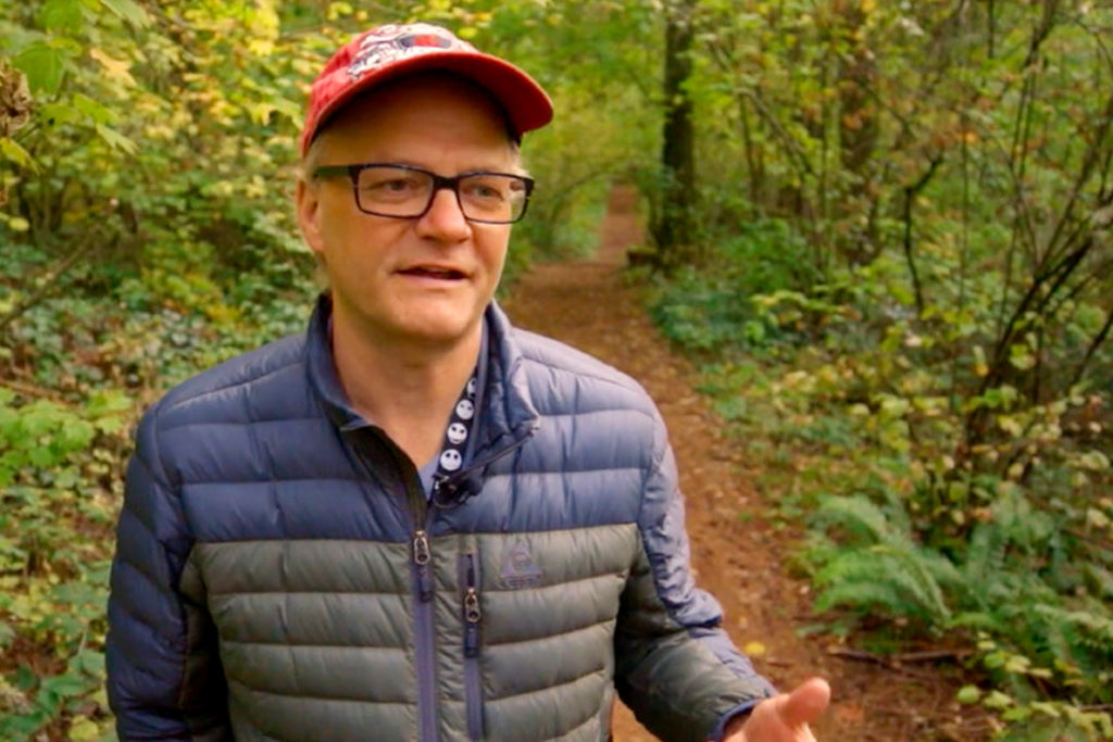 Closeup of Brian Brandt in forest.
