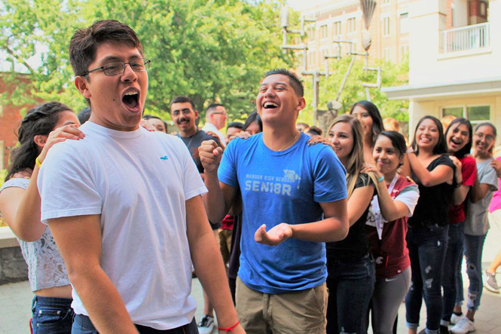 Students participating in a rock-paper-scissors competition.