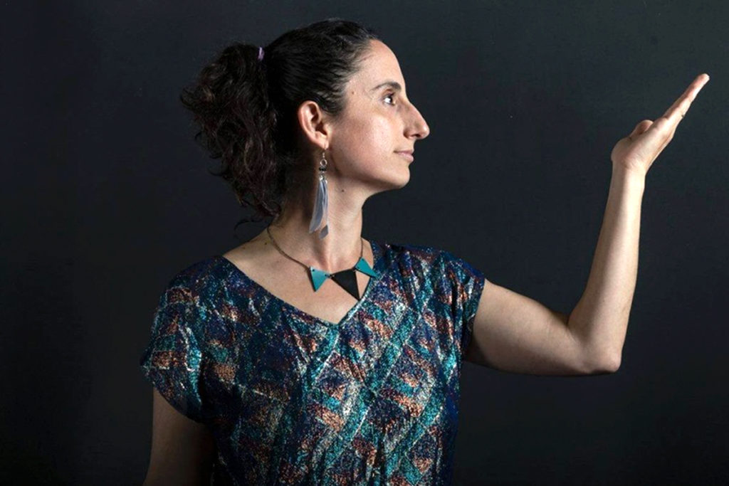 Nitivia Jones models fluid fashion clothing.