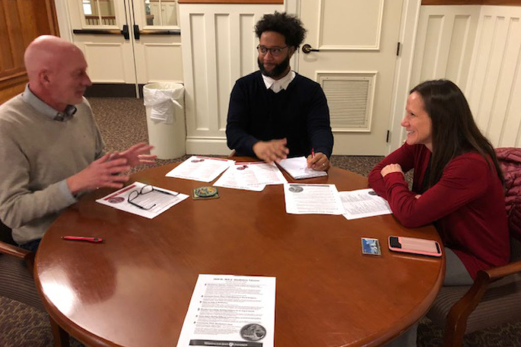 Honors College Dean Grant Norton (left), Trymaine Gaither (Honors College) and Joanne Greene (University Recreation) discuss a series of mindfulness activities planned for MLK Week.