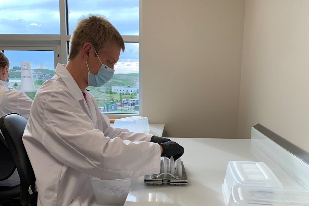 Two students work in a lab.