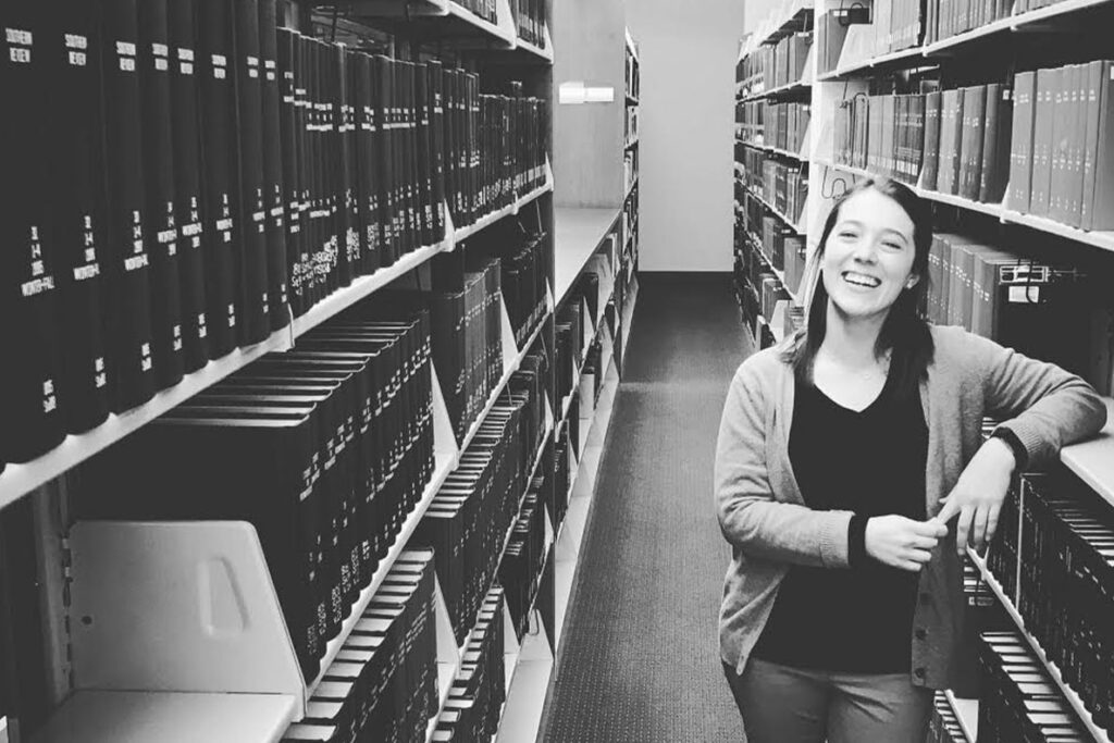 Jen Saulnier standing in aisle of a WSU library.