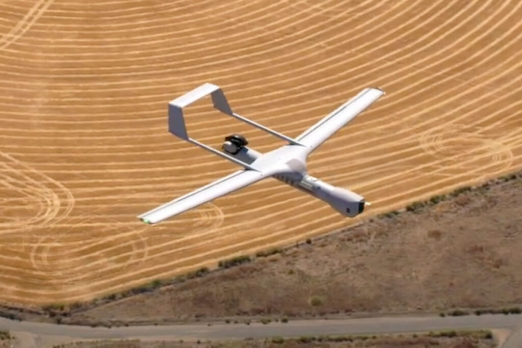 A drone flying over a wheat field