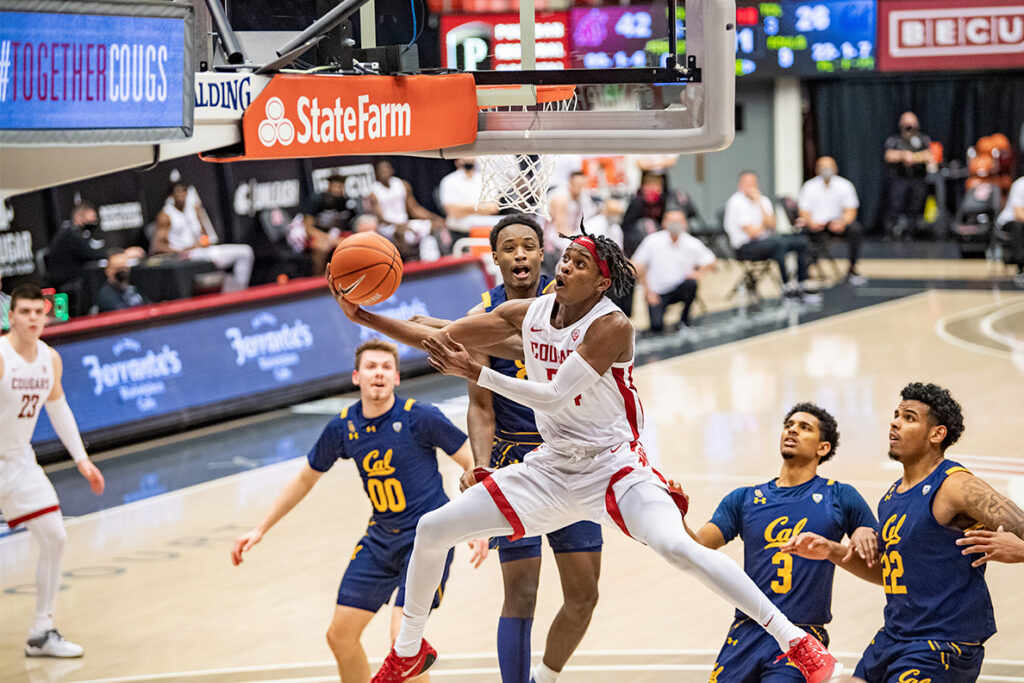 Noah Williams driving to the hoop during a WSU men's basketball game.