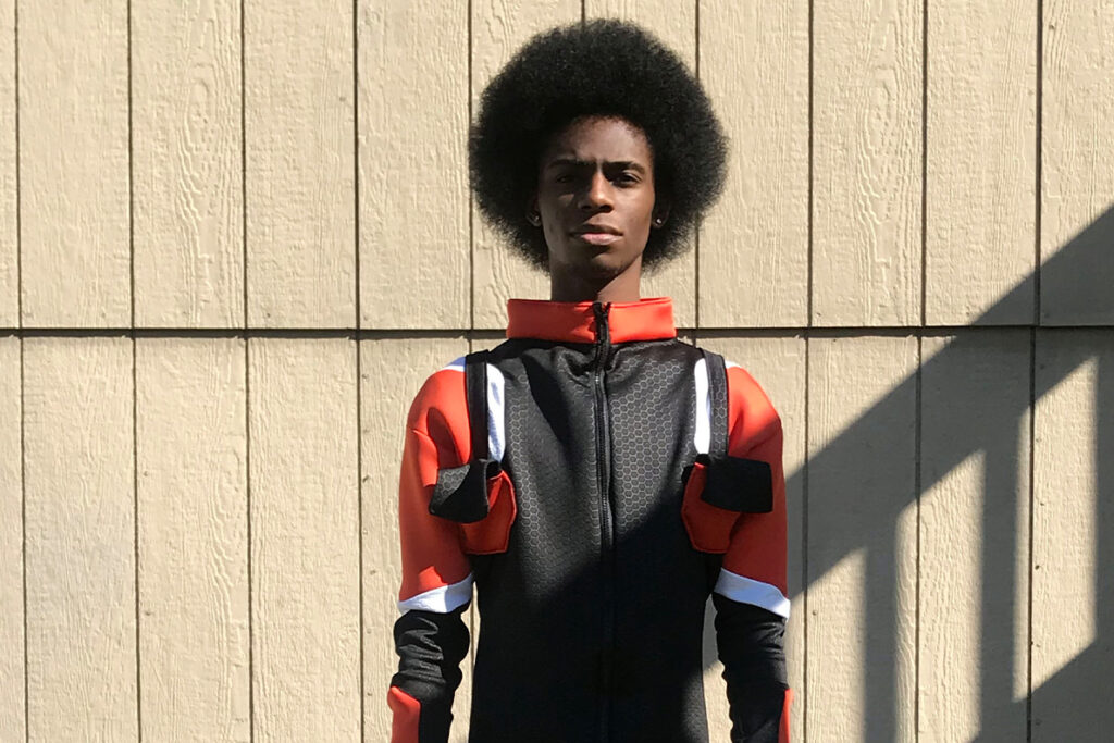 A young man models a space suit