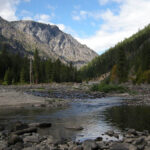 A river with mountains in the background