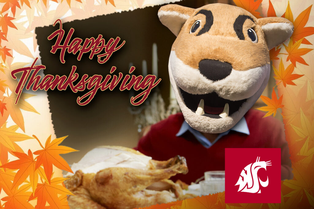 Butch T. Cougar at the dinner table with a Thanksgiving Day turkey.