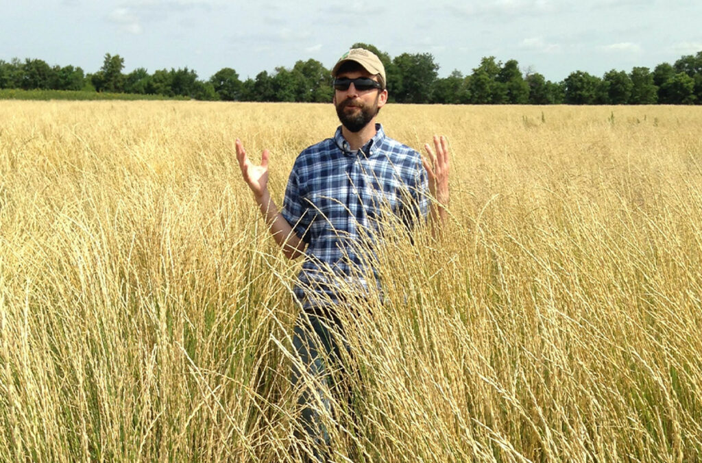 Closeup of Steve Culman standing in a field of tall grass.