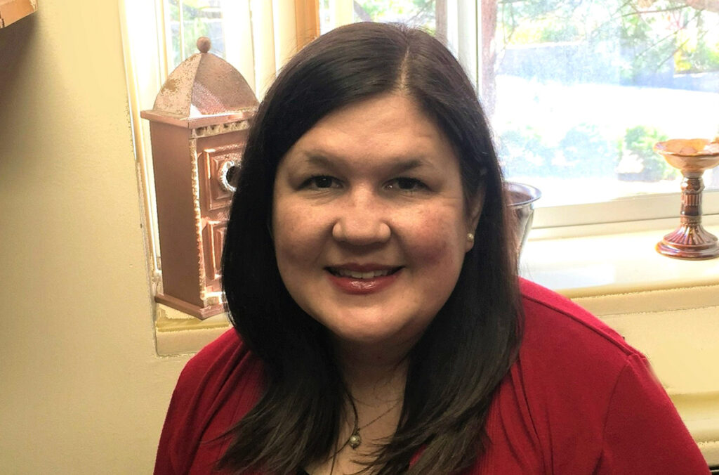 Closeup of Tammy Barry sitting in front of a window.