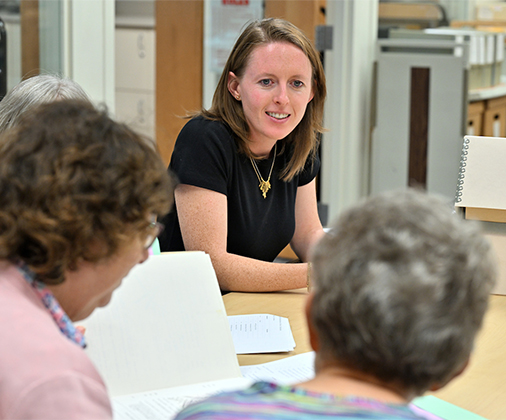 A portrait of Katie Forsythe taken in the library