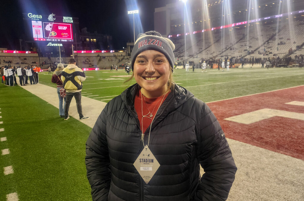 Kinsey Kallahar on the sideline of Gesa Field at the WSU Pullman campus.