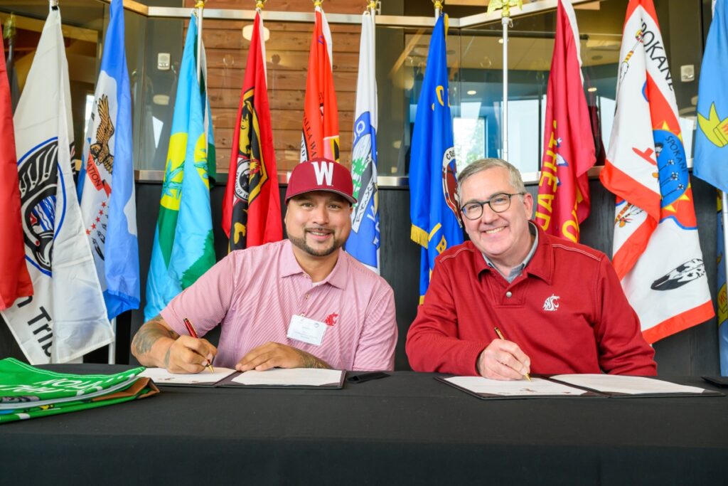 Dustin Klatush and Kirk Schulz signing a memorandum of understanding.