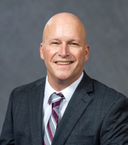 Dave Cillay in a suit and tie.