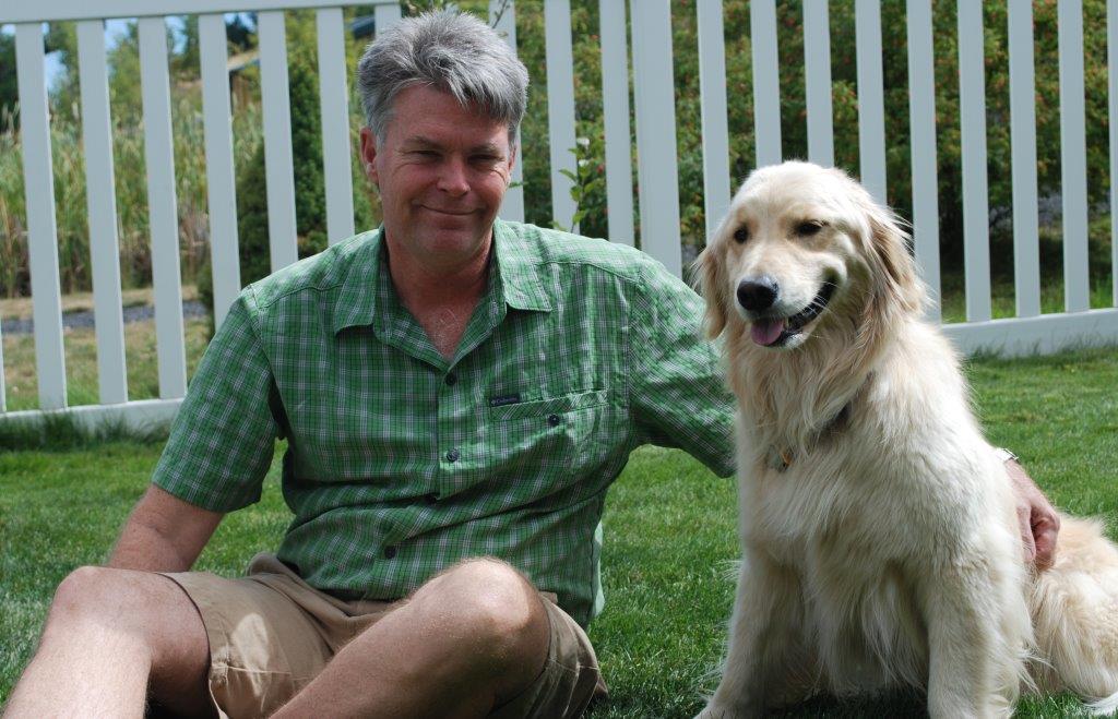 Dr. Michael Court poses for a picture with his golden retriever, Mattie.