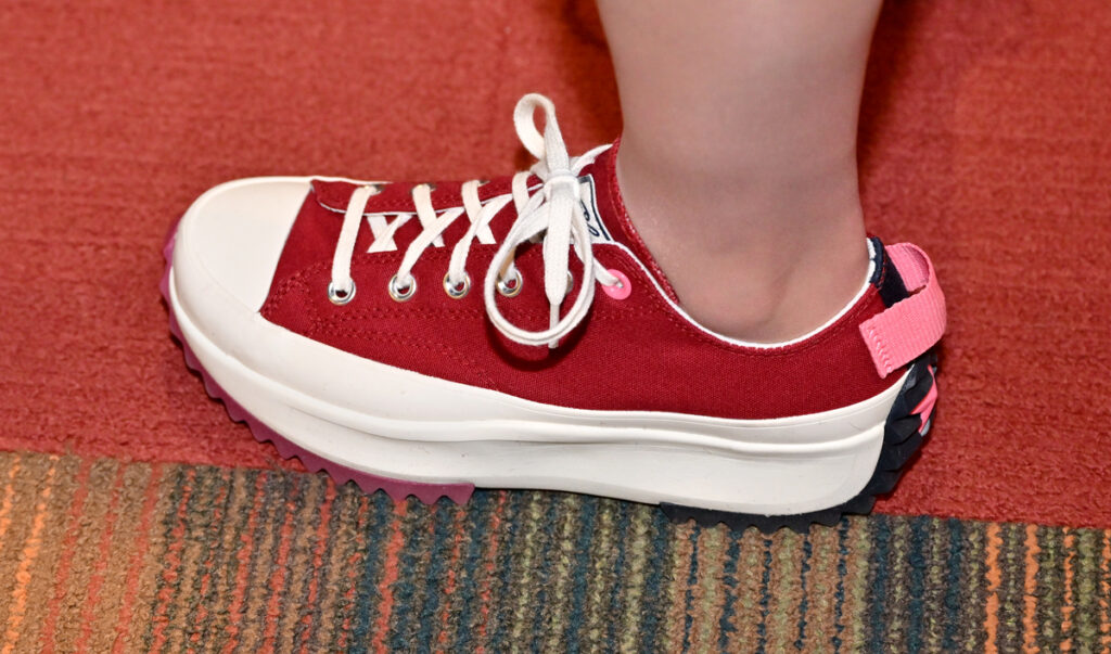 Closeup of a red and white sneaker.