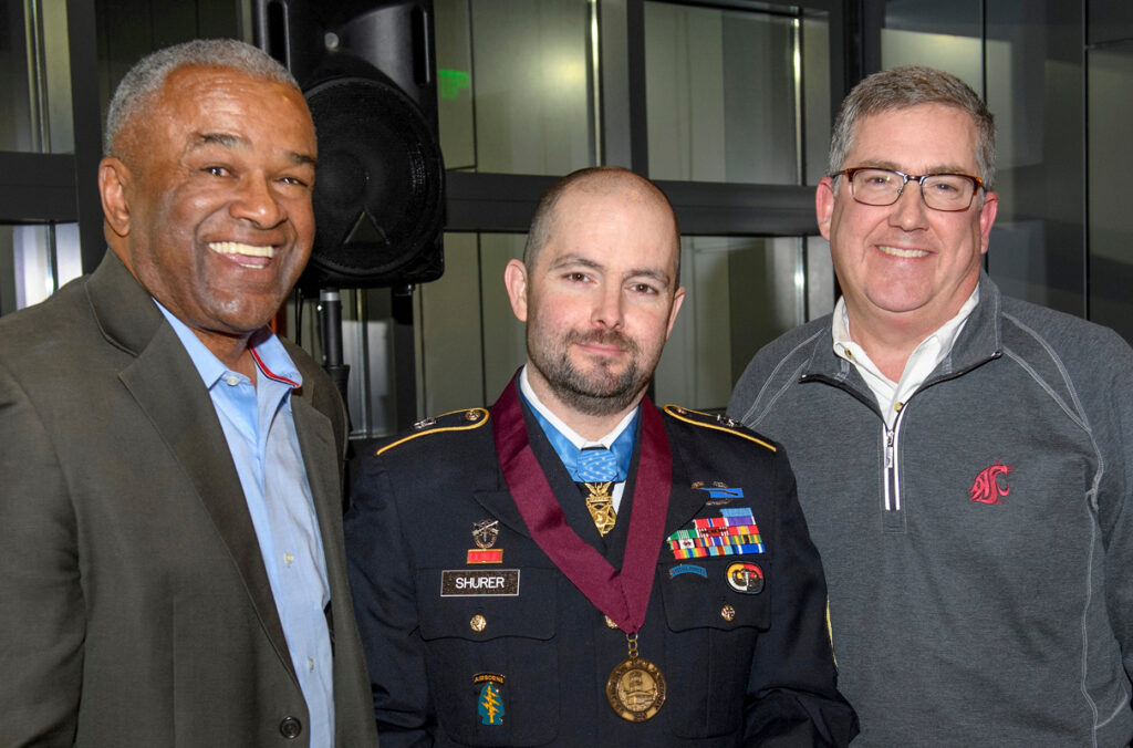 WSU President Kirk Schulz, former WSU Regent Ron Sims, and Medal of Honor Recipient Ronald J. Shurer II.