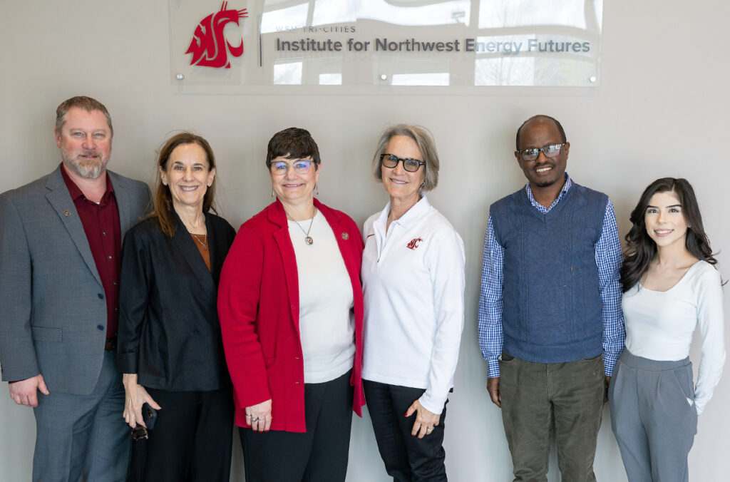 WSU President Elizabeth Cantwell poses for a group photo while touring the Institute for Northwest Energy Futures.