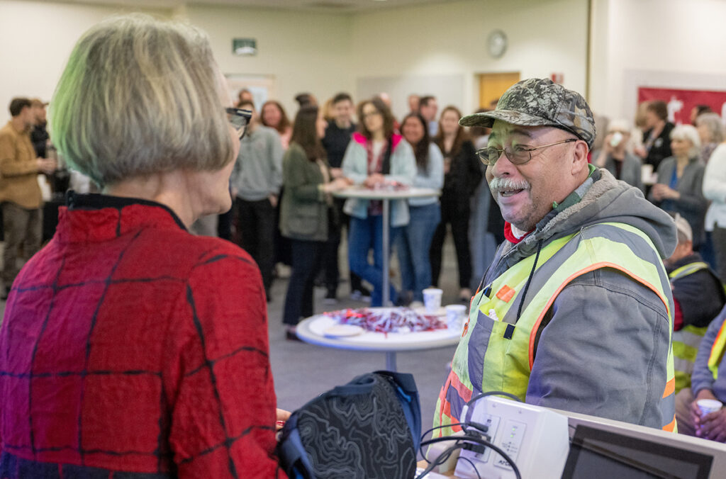 WSU President Elizabeth Cantwell visits with a WSU Vancouver employee.