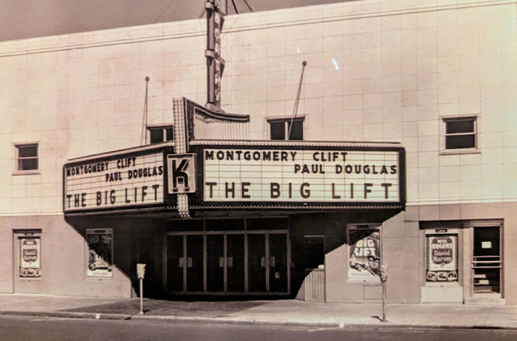 A black and white photo of the marquee outside the Kenworthy Theater in 1950.