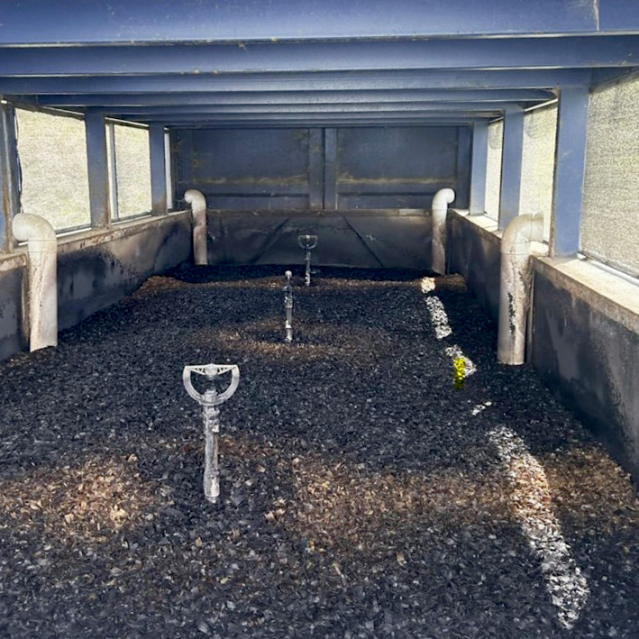 Closeup of a a shelter filled with soil that is part of a biodynamic worm farm at Northstar Winery.