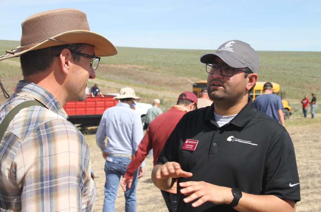 Lind Dryland Research Station Director Surendra Singh speaks to visiting growers and professionals at the 2024 Lind Field Day.
