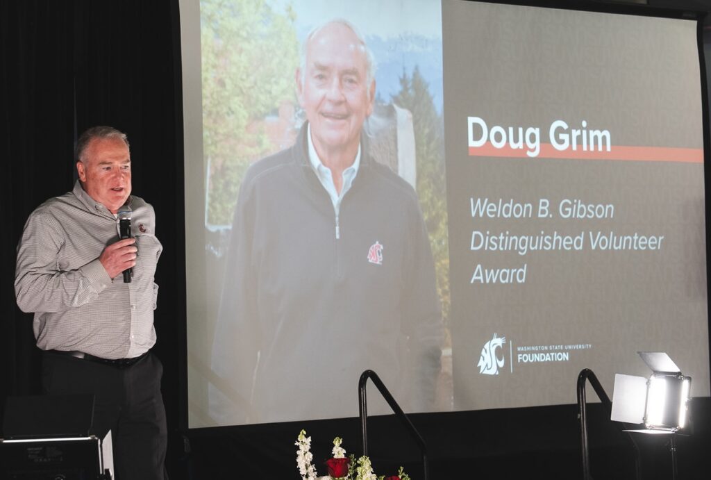 Mike Connell, vice president of Advancement and CEO of the WSU Foundation, recognizes Grim, who was unable to attend the event.