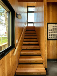 A wooden stairway inside Matt's Place 2.0.