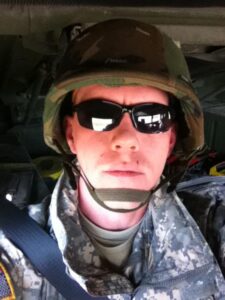 Closeup of Jadon Hawkins in military fatigues.