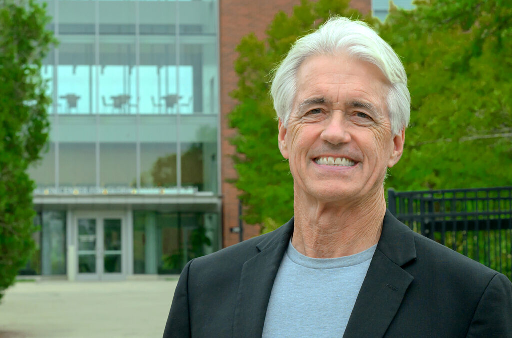 Closeup of Guy Palmer standing outside the Paul G. Allen School for Global Health.
