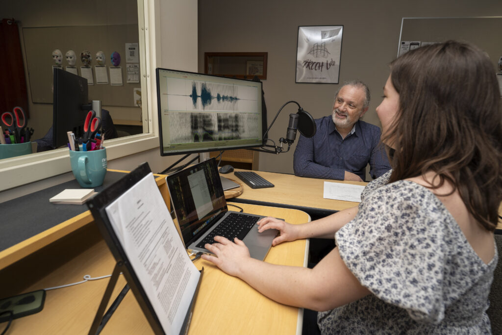 A student works with a research participant in the accelerating Research in Cognitive Communication Health (ARCCH) Lab.