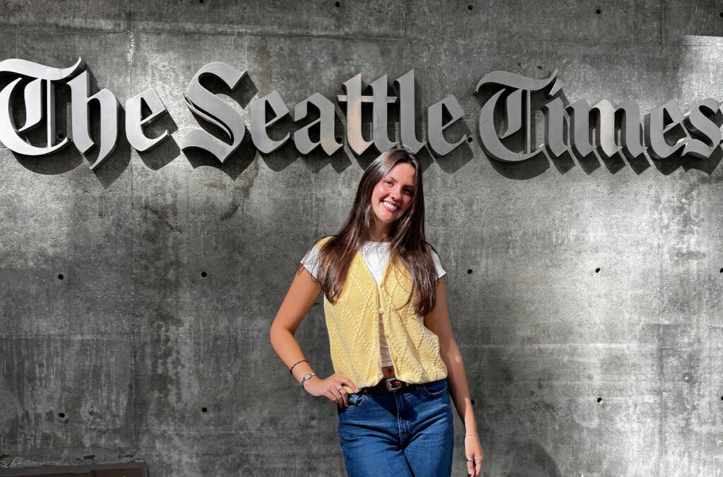 Former WSU journalism student Lauren Rendahl poses for a picture in front of the Seattle Times building.