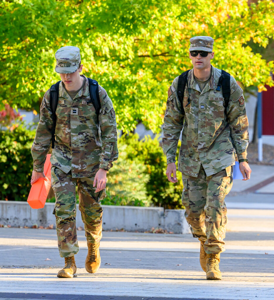 Two ROTC students wearing Air Force fatigues walking across the Pullman campus.