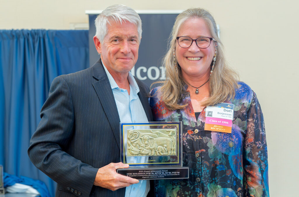WSU College of Veterinary Medicine Dean Dr. Dori Borjesson, poses with UC Davis School of Veterinary Medicine Dean Mark Stetter, as she receives an Alumni Achievement Award.