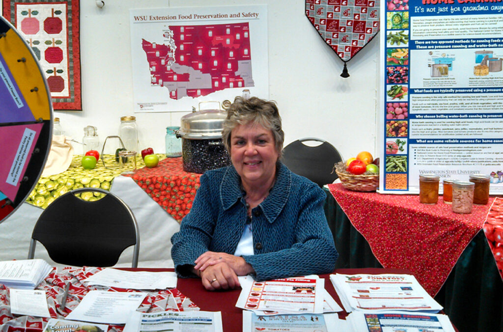 Margaret Viebrock surrounded by WSU Extension education materials.