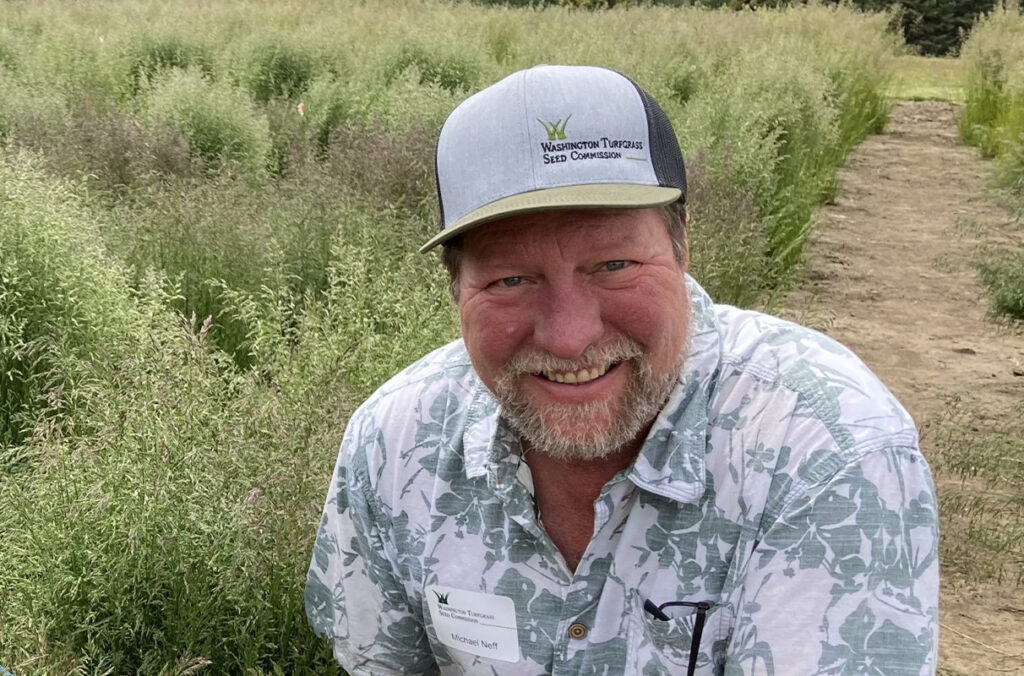 Closeup of Michael Neff in a field.