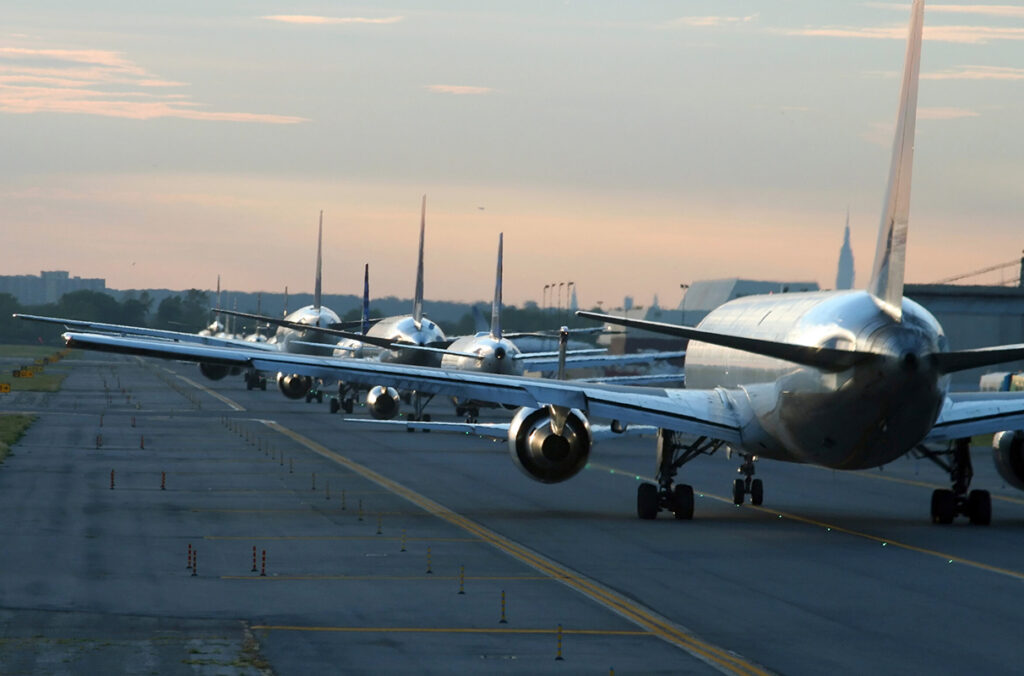 Planes can be seen lined up on the tarmac at New York JFK Airport.