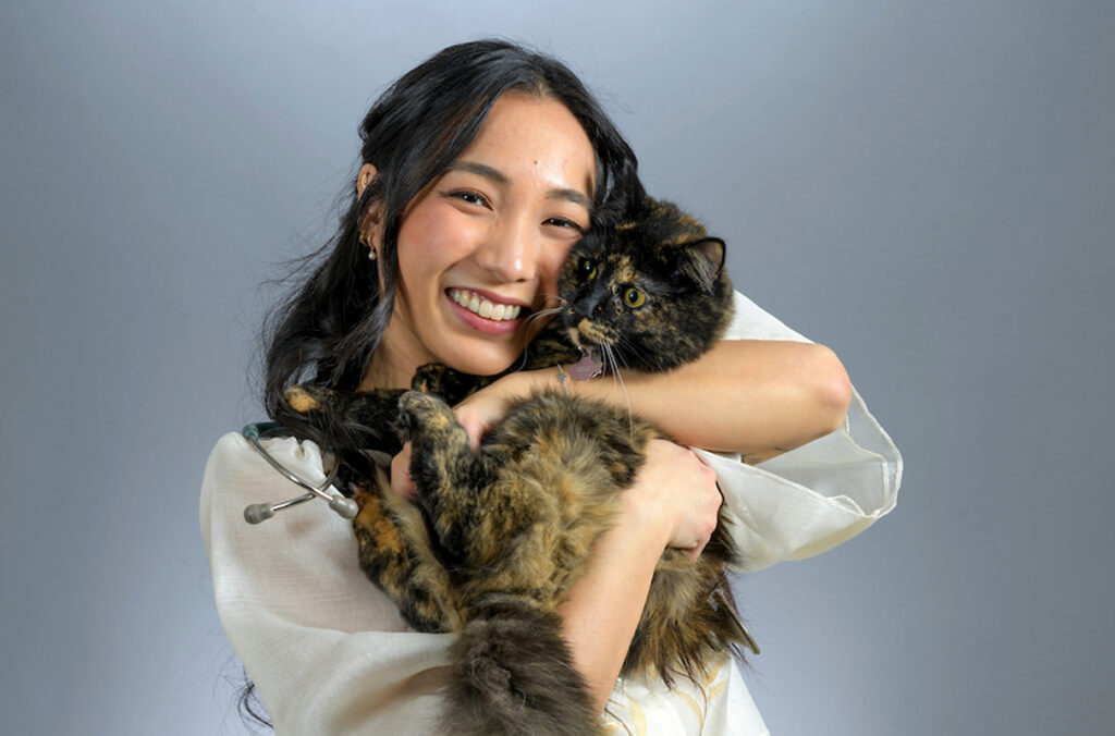 Closeup of Anjelica Bautista holding a cat.