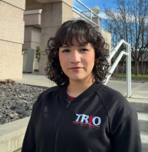 Closeup of Carola Garcia Mendez outdoors on the WSU Tri-Cities campus.