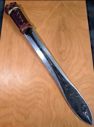 Closeup of a short, double-edged sword crafted by members of the WSU Material Advantage Club.