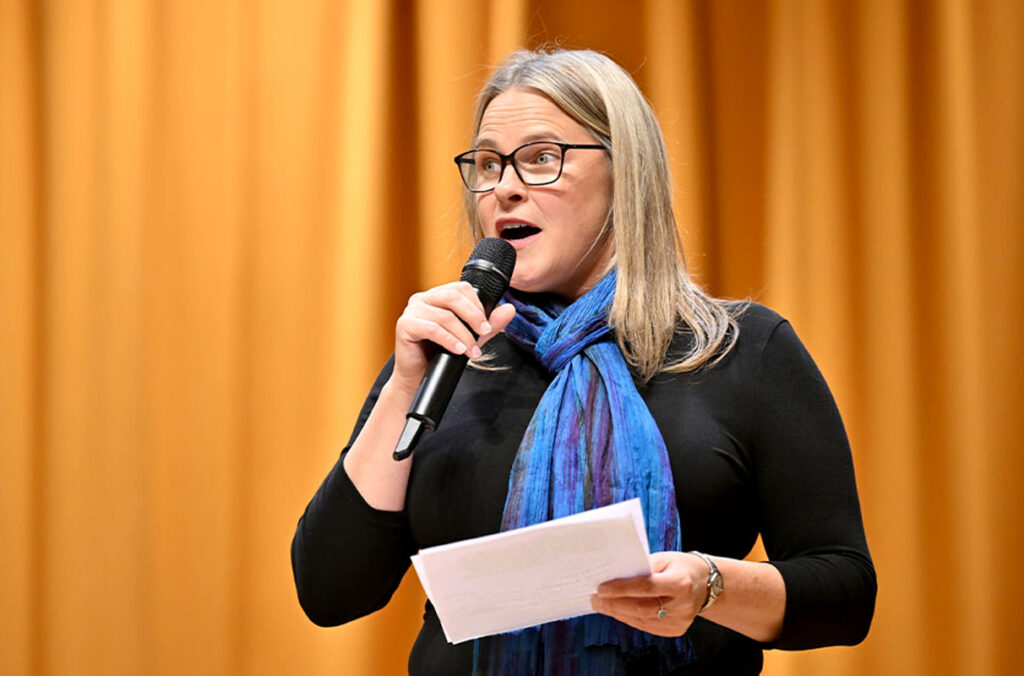 Closeup of Melissa Parkhurst speaking into a microphone.