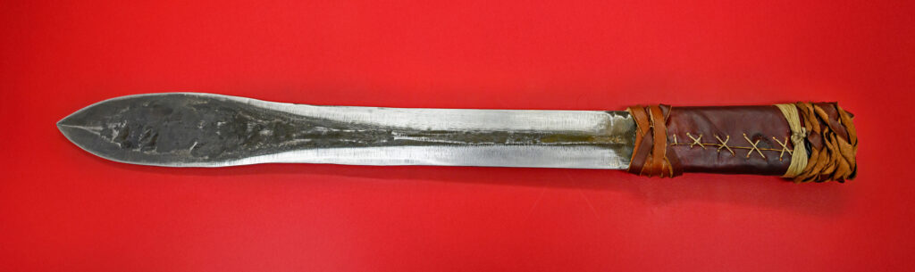 Closeup of a short, double-edged sword crafted by members of the WSU Material Advantage Club.