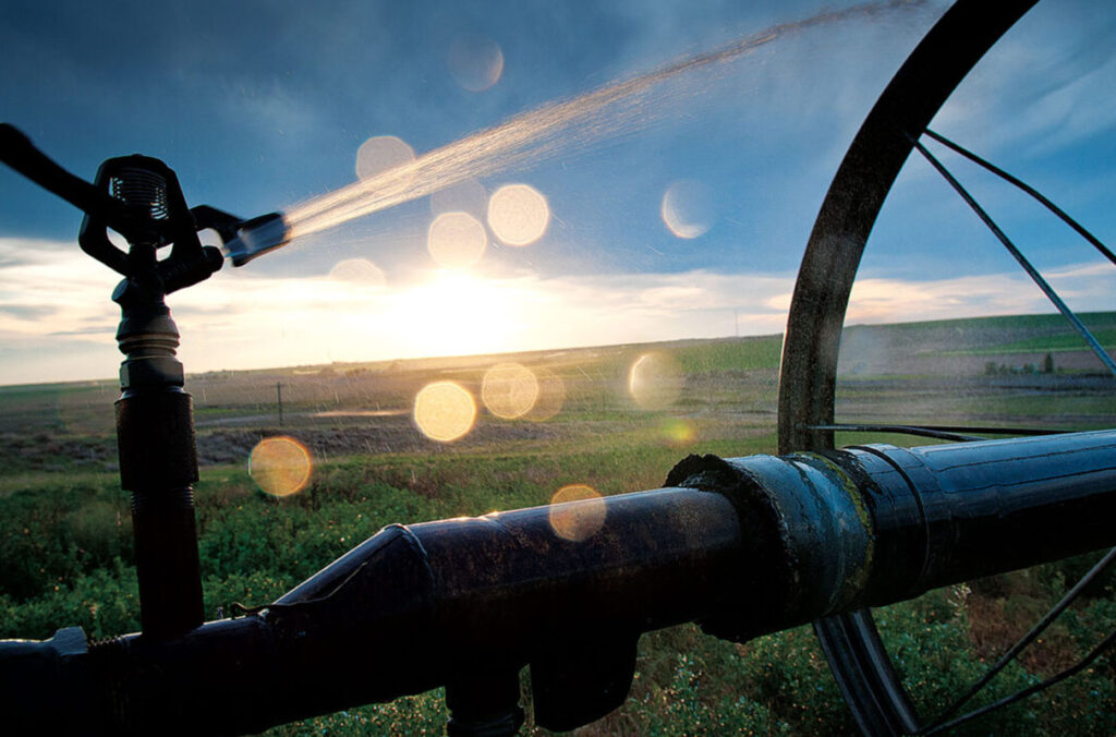 An irrigation system watering an agricultural field.
