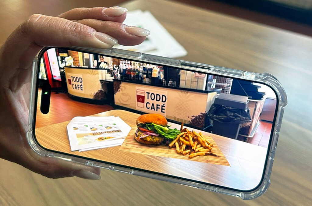 A smartphone app displays food at a restaurant.