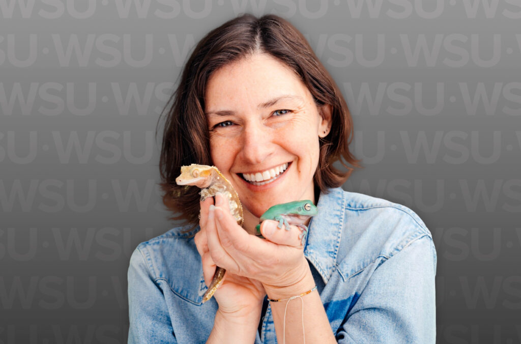 Closeup of Erica Rosenblum holding two lizards.
